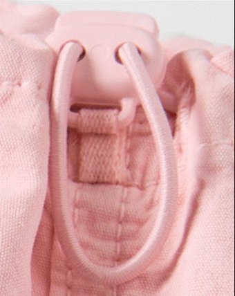 Image of close up of toggle on drawcord.
Not allowed on preemie to 5T.  
Allowed on BIg Kids when meeting construction c