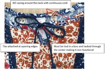 image of neck line with attached ends.  not allowed preemie to 5T but is allowed on big kids.  must meet criteria listed