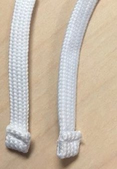 Image illustrates example of acceptable drawstring ends